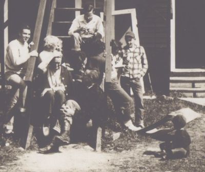 Gathering on the old steps of Bonnie Lodge. Hugh Liddle on bottom step, Joe Perry sitting on the ground. 1952.